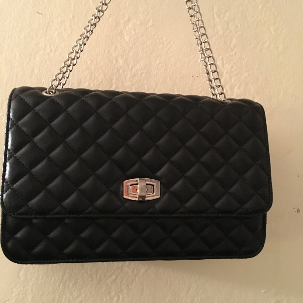 Quilted black bag pre own .